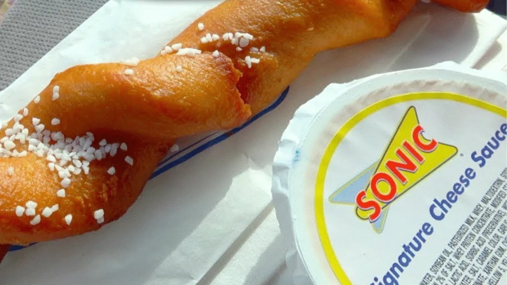 soft pretzel twist with signature cheese sauce